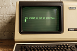 A 1970s computer with black screen and green text. Model: VT100