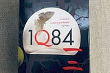 Lost in the world of double moons and Little People. 1Q84 by Haruki Murakami.