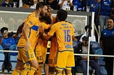 Tigres players celebrate their decisive goal of the match