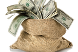 A burlap sack full of one hundred dollar bills.