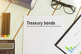 Treasury Bonds pamphlet on a table.