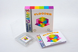 The game box, manual and cartridge of my game Flooder.