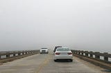 Fog on a bridge obscures the destination.