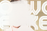 A White man’s face is whitened out by heavy swaths of white paint against a background with the letters, WOKE