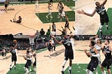 NBA Playoff 2021-Khris Middleton fall by Joe Harris during big throw in the bucket