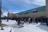 Texans line up outside a grocery store during the winter storm that knocked power offline.