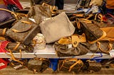 a display of fake Louis Vuitton bags