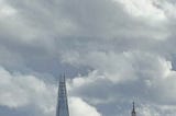 view of St Pauls and The Shard under a cloudy sky