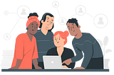 4 pessoas em volta de um notebook conversando, onde um deles está digitando