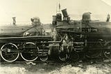 Two old steam locomotives, having been in a head on collision, may be viewed as a singular object now.