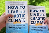 Two hands holding up two “How to Live in a Chaotic Climate” books