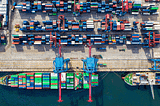 Photo of an ocean port from above as originally published on Walton Insights