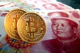 Two bitcoins rested on Yuan, China’s currency