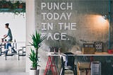 Wall that says “Punch today in the face” | image from unsplash | Johnson Wang @jdub