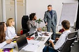 Manager Setting Goals in a Meeting