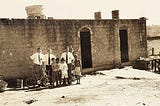 A picture from my church mission; standing in front of a home where we taught a family