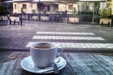Morning coffee by an empty square. Main image to the personal essay ‘Life Without a Map’ by MARTIN WÆRN and the Shearwater Chronicles.