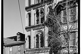 Custom Lumber Millwork sign is visible on a 4 story building depicted in this black and white photo from the city’s historical archives. HABS No. PA — 1572–1.