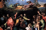 A painting by Raphael depicting the Transfiguration. Jesus, Moses and Elijah float in the air, with Peter, James and John laying on a rock below them and other disciples, in a state of agitated excitement, below them.