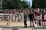Banners at Front of BLM March: Defund Police and Loot it ALL