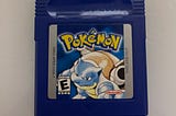 A copy of Pokemon Blue for the Game Boy.