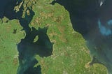 What does the coastline of Great Britain have to do with project delays?