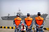 AP/file — Sailors from the Chinese navy watch as the U.S.S. Blue Ridge arrives in Shanghai on May 6, 2016.