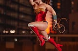 This is a photo of Wonder-woman showing off her superpowers while running in mid air.