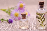 essential oils and violet flowers