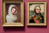 Two side by side portraits — one of Emma Hamilton and one of Horatio Nelson.