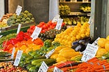 A market stall with various types of vegetables