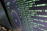 Computer screens with cyber security programs running in background