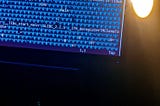 Image of a computer with compiled language in a text editor