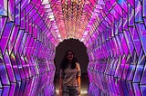 Anupriya walking down the light color tunnel in SF MOMA Museum