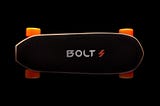 an Electric Skateboard over a black background