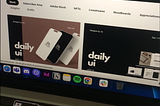laptop screen displaying the behance projects: daily ui, designs by jo