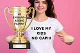 A woman with a shirt that says “I love my kids no cap” and a trophy that says #1 embarrassing parent