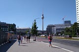 A snapshot of the road leading to Alexanderplatz (Berlin) with the famous TV Tower standing tall in the background.