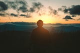 Man staring at the sunset