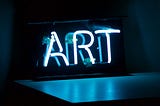 Neon sign that reads “ART”.