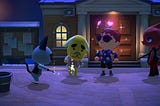 Raymond the cat and Benjamin the dog hold lit sparklers with Marek watching while looking proud in a night time scene.