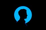 Silhouette of a man behind a glowing blue circle.