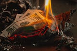 Pile of money burning