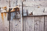 Abandoned and locked wooden door