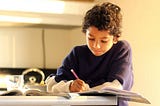 image of boy studying during shelter in place