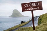 Close for Maintenance sign in front of an outdoor path in a Faroe Island.