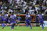 Violette AC celebrate after beating Austin 3–0