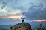 A guy standing on a rock, ready for his new adventure