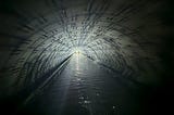 Interior of a long, straight, narrow canal tunnel.
