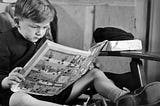 This is a boy reading a comic book Getty images/Hutton Archive